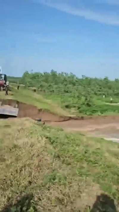 Trying to stop a dam breach in China’s Hunan Province. 7/5/2024