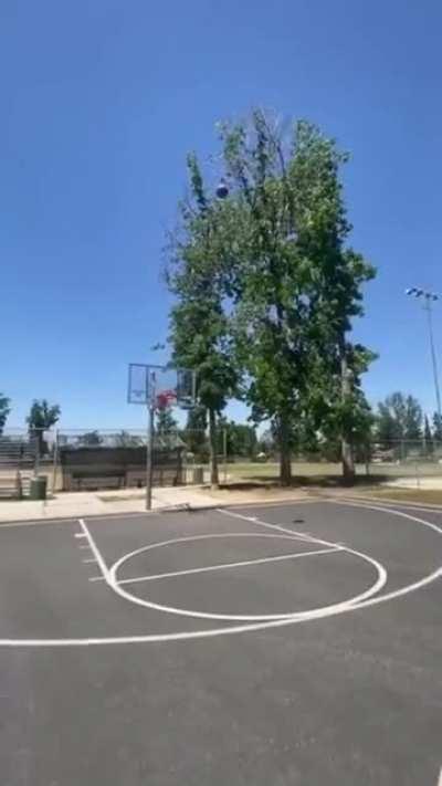 Cop decides to join in for some basketball and hits an amazing shot.