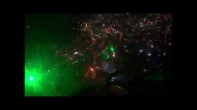 Chile Protesters bring down a police drone using dozens of laser pointers