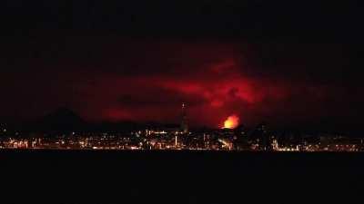 Reykjavik skyline illuminated by a volcano