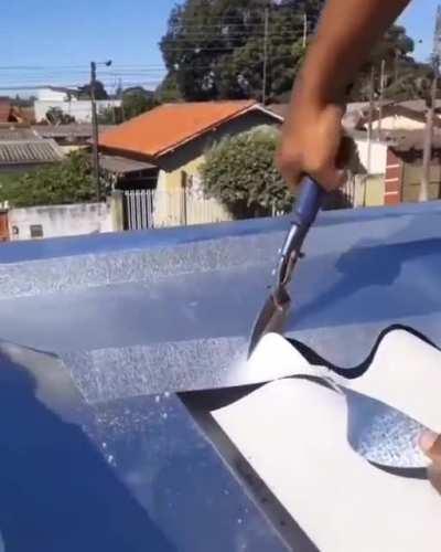 Handcutting the ridge of a metal roof