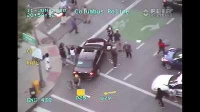 Protesters/Rioters in Columbus pulling a driver from their car. June, 11th.