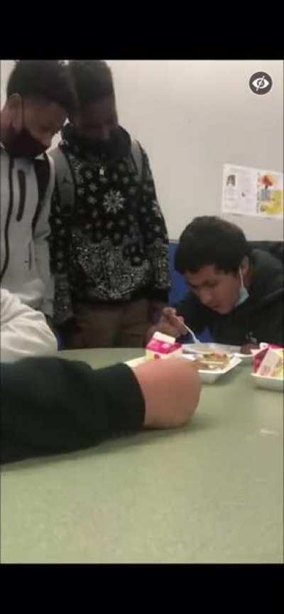 Two bullies sucker punch and beat another student eating his lunch