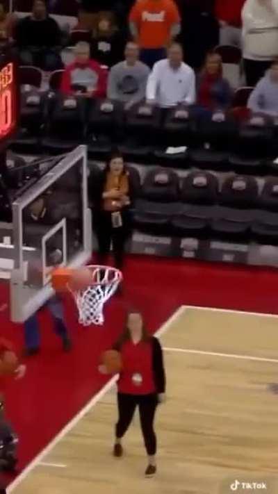 Man in a hotdog costume uses a pickup line then makes a halfcourt.