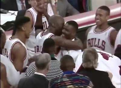 Chicago Bulls fan Don Calhoun sinks a 75-foot shot to win 1 million dollars and gets a hug from Michael Jordan (1993)