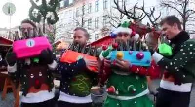 Street musicians playing a christmas song only on bottle's.