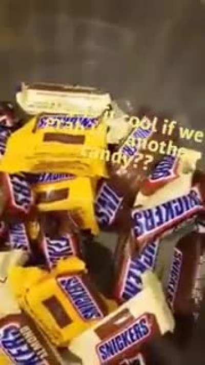 This man handing out candy in a bathroom stall!