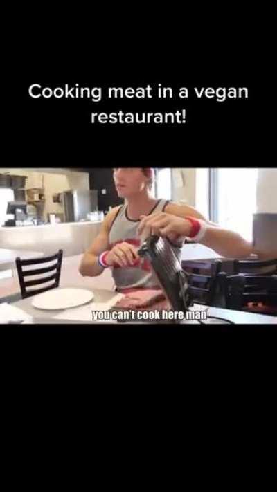 Youtuber cooks meat in a vegan restaurant