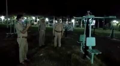 Video shows police officers investigating a piece of playground equipment that is moving on its own