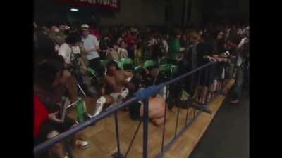 Kota Ibushi clears the barricade with a Running Springboard Moonsault onto Prince Devitt • NJPW Best Of Super Jr (2009)