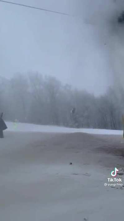 A skier trapped on a lift directly above a broken pipe at Beech Mountain