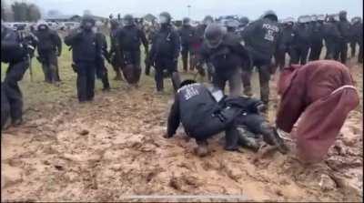 German riot police defeated and humiliated by some kind of mud wizard