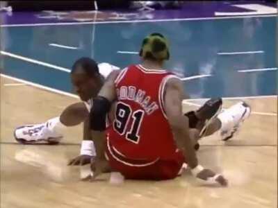 Karl Malone and Dennis Rodman tripping over each other