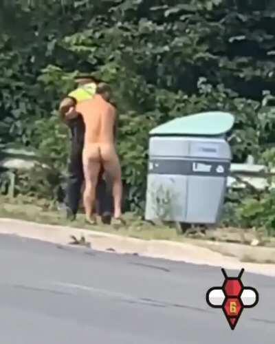 Naked guy tosses cop into the bushes