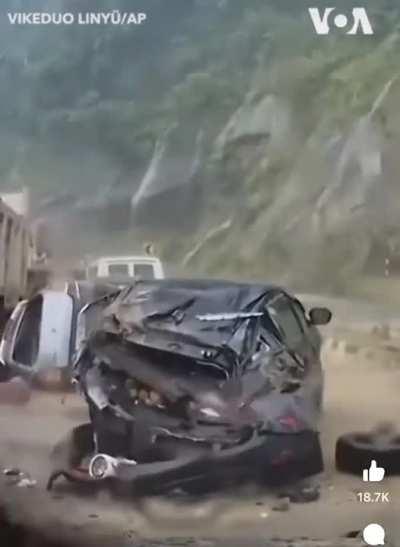 Car gets crushed by boulder