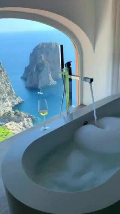 A bathroom with a beautiful view in Capri, Italy