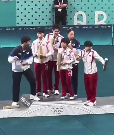 North and South Korean athletes take a selfie together at the Olympics