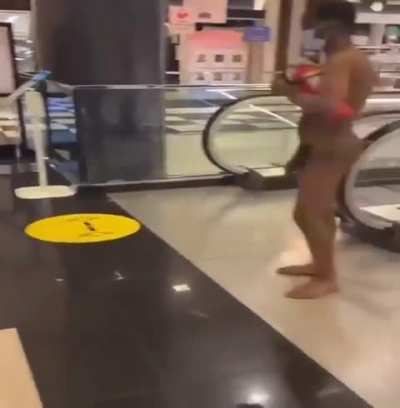 Naked guy at the Mall gets whacked by a dude who's seen enough dick & ass for the day.