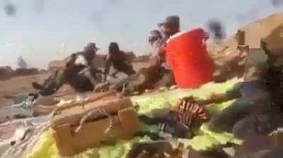Iraqi pmf fighter gets shot in the abdomen by isis fighters immediately after his comrades were warning him to get down, the fighter died on the sight shortly after due to lack of supplies and first aid equipments.