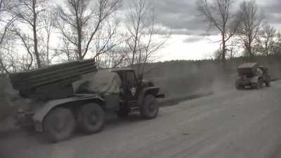 Russian tanks under a red banner are moving to the front in Ukraine