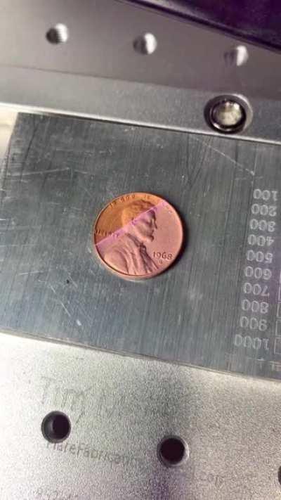 Laser cleaning a penny.