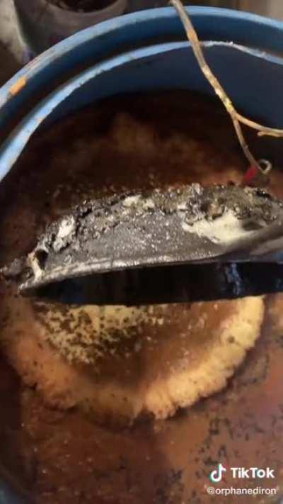 This removal of gunk on a cast iron pan