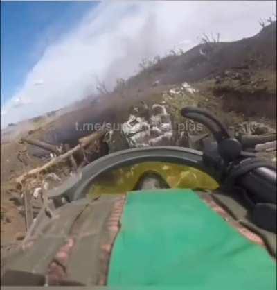 Ukrainian troops storming a Russian position in eastern Ukraine, enemy visible. Date and location unknown.