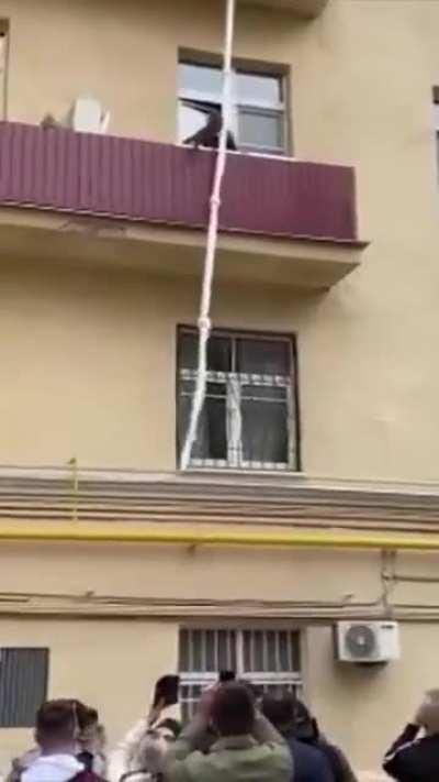 Man sleeps with someone's wife and attempts to escape by a robe from the balcony