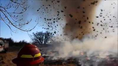 Dust devil wanders into a wildfire, sending hundreds of tumbleweeds spinning through the air