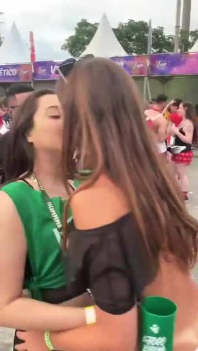 Brazilians kissing at party