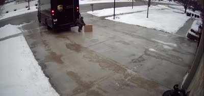 This delivery driver using the ice to deliver the package over to the owner.