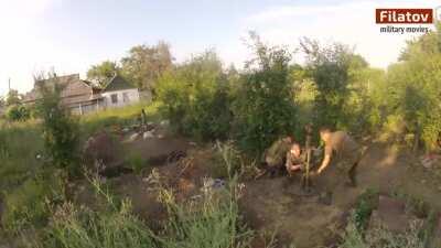 Separatist 82mm mortar team shrugs off a misfire while engaging Ukrainians dug in near Marinka - 2015