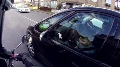 Dude lets kid rev his bike at traffic lights