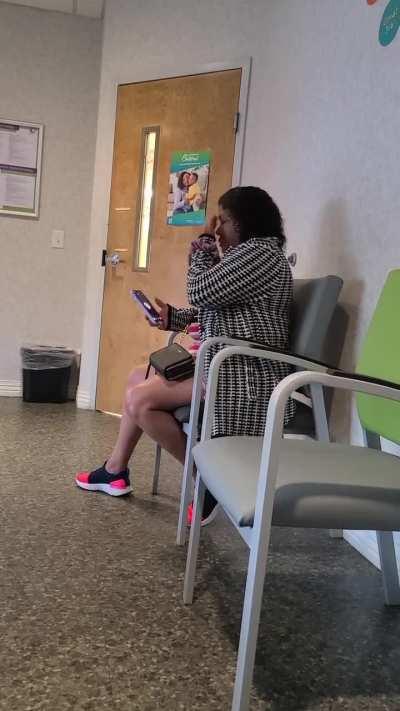 Lady talks on speaker phone in waiting room at pedatrics the WHOLE TIME. Some parents left to wait in car. How can she be so oblivious?