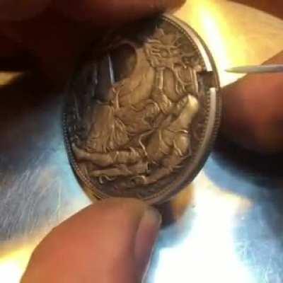 Coin with hidden surprise hand carved by Roman Booteen