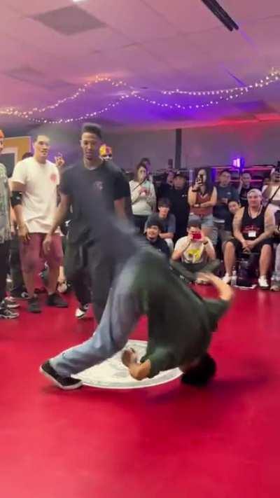 Breakdance Battle. B-Boy Hyun Joon responds to a flip.