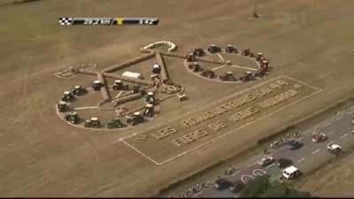 Local Farmers make a bike out of hay and tractors Tour De France - 2011