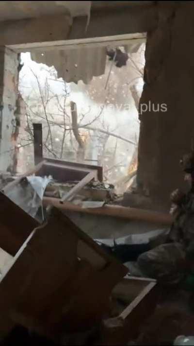 Ukrainian soldier detonates a nearby building rigged to explode somewhere in Bakhmut