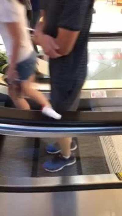 Fickle stick on an escalator