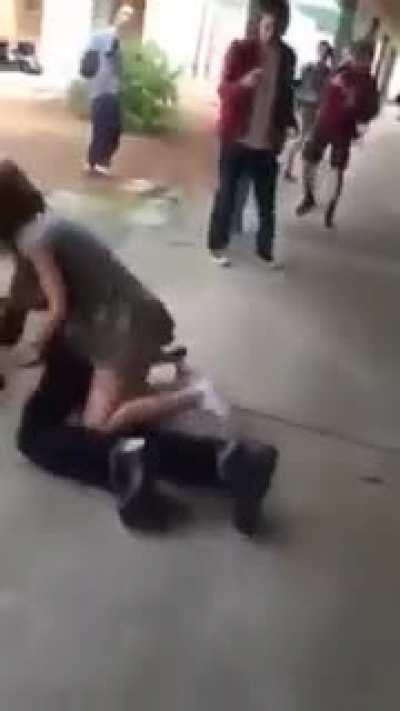 Girl completely destroys a guy during a school fight