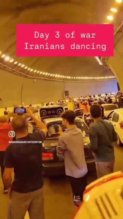 While bombs rain down on their leadership Iranians stop their cars under tunnels to dance - an act that is prohibited by the Islamic regime