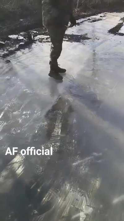 Ukrainian soldiers find a frozen puddle and of course decide to have some fun!