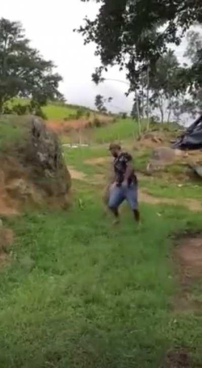 Man jumping over sheep