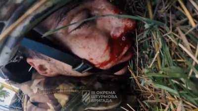 Seriously wounded soldier of Ukrainian Army's 3rd Assault Brigade records a video of his farewell to his relatives during the summer battle for Andriivka.