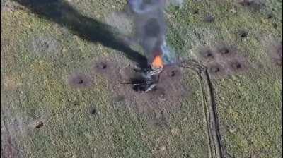 Ukrainian FPV drone finishes off an abandoned Russian BMP next to an already destroyed T-90M tank. The BMP burns.