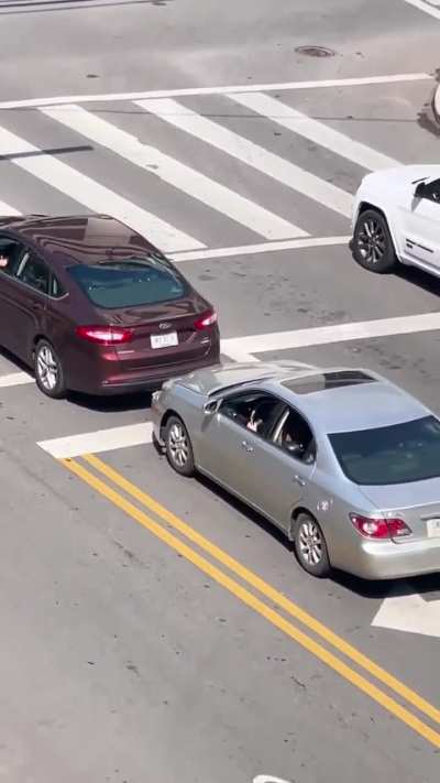 Road rage fight at an intersection