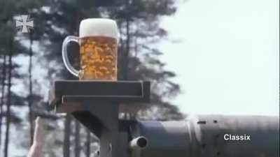 Using a mug of beer to test the gun stabilization on a German Leopard 2 tank...