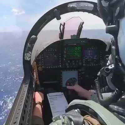 View from inside of an F-18 cockpit as it takes off from an aircraft carrier