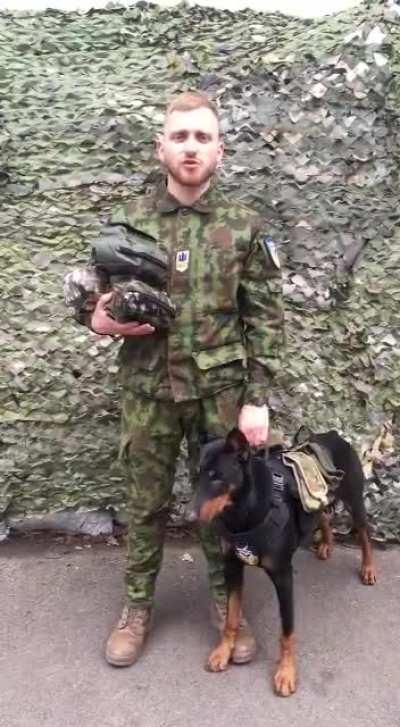 Ukrainian Soldier and War Pup thanking the international community for its continued military aid