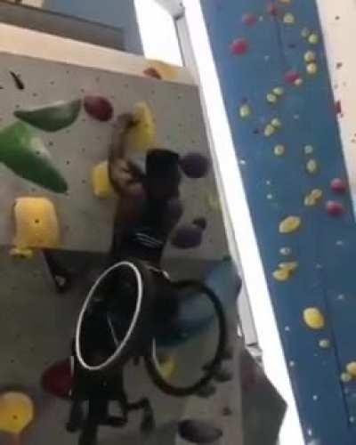 This disabled guy that climbs this climbing wall like a pro